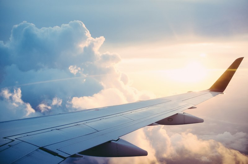 View of an airplane wing in warm evening light
